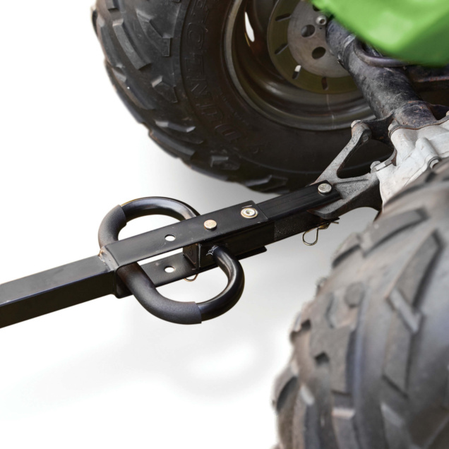 Close-up of a Gorilla Made heavy-duty cart hitch connected to a large tire.