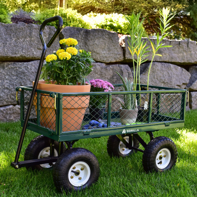Green Gorilla Made utility cart with potted plants, on grass, showing brand logo.