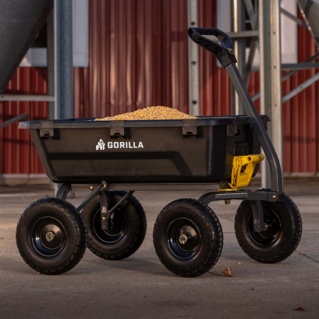Black Gorilla cart loaded with corn, featuring sturdy wheels and a yellow holder.