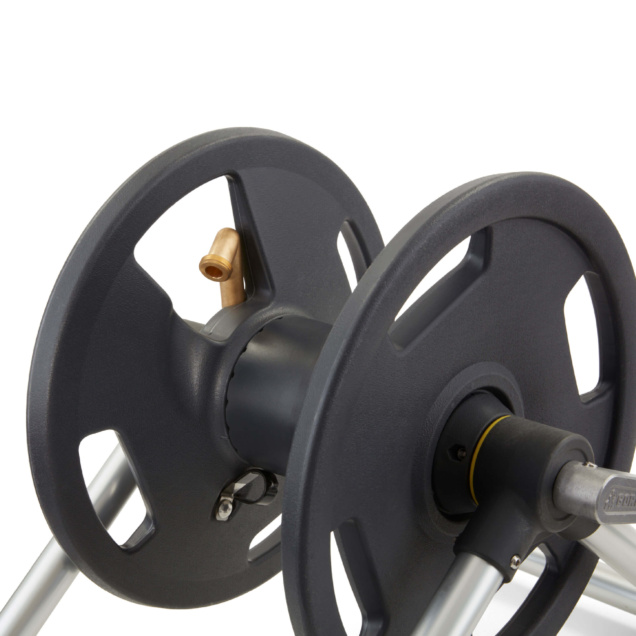 Close-up of a Gorilla Made dark gray hose reel wheel with a brass connector.