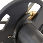 Close-up of a gray hose reel with a black hose and a brass connector. Text: "Continental".