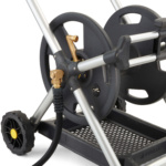 Close-up of a gray Gorilla Made hose reel with metal frame and rubber wheels.