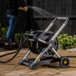 Gorilla Made hose reel in use, watering plants on a patio.