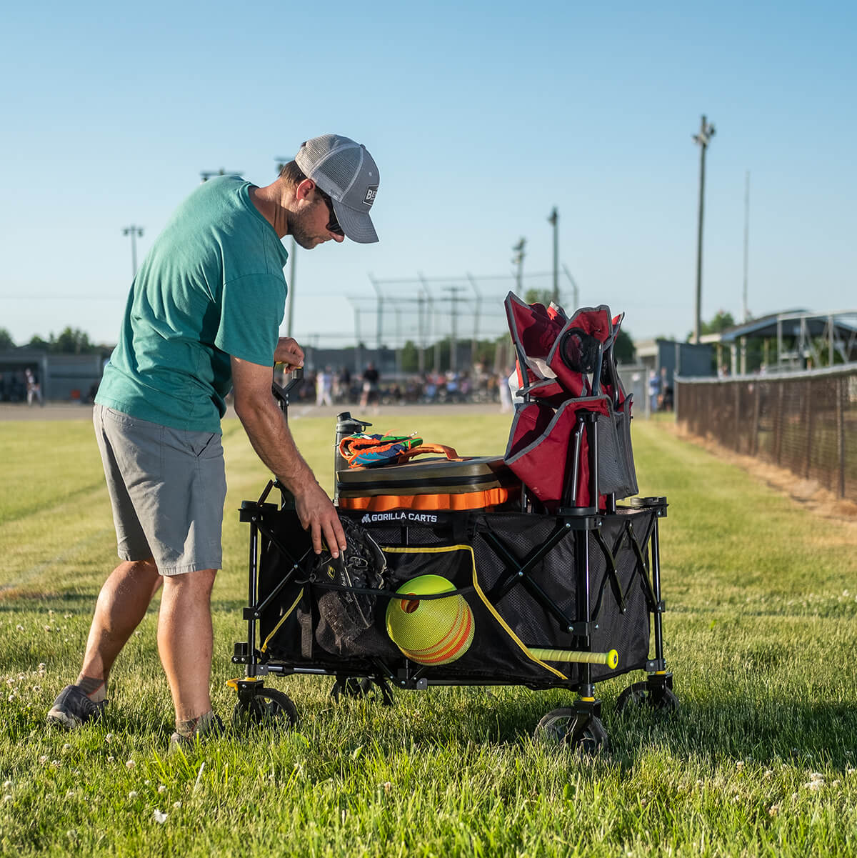 Man carrying equipment to watch a game