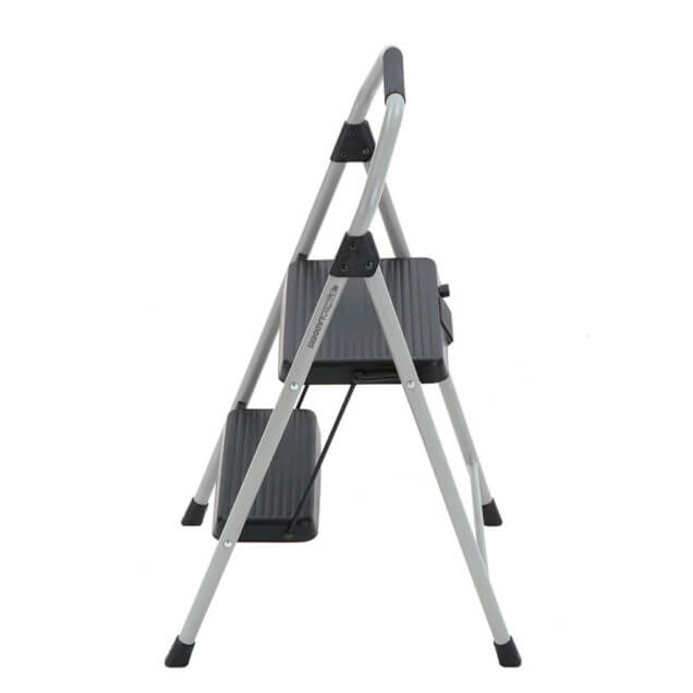 A side view of a Gorilla Ladders step stool with gray steps and a silver frame.