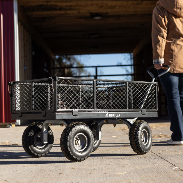 Gorilla Made utility cart with mesh sides and large wheels, logo visible.