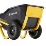 Black and yellow Gorilla wheelbarrow with sturdy tires, labeled "GORILLA".