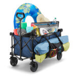 Blue Gorilla Made cart filled with colorful beach gear and inflatables.
