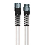 Clear garden hose with black reinforced connectors, showcasing durability.