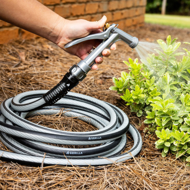 Gray Gorilla garden hose watering plants, showcasing durability and performance.