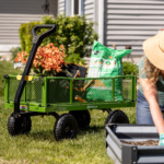 Green Gorilla utility cart with garden supplies on grass. Text: "GORILLA".
