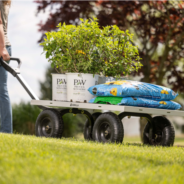 Gorilla cart with plants and potting mix bags; "Proven Winners" text visible.
