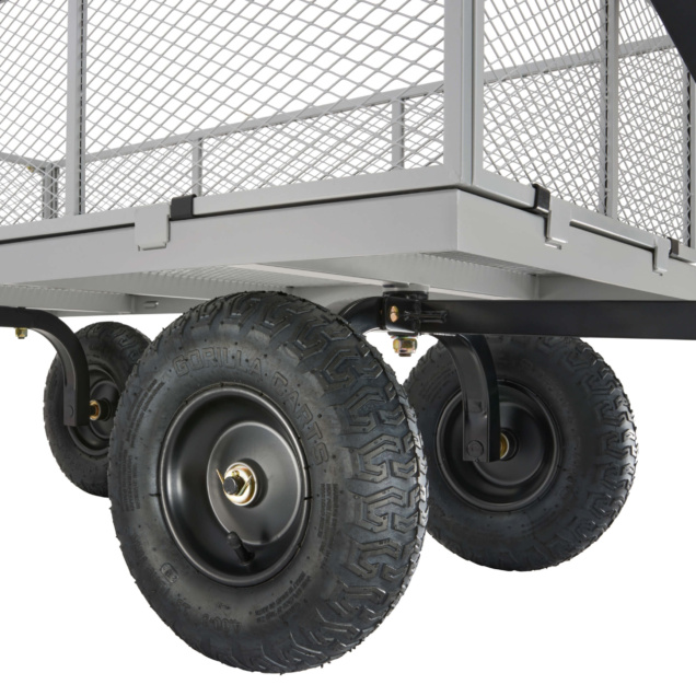 Close-up of a Gorilla Made heavy-duty cart with sturdy black tires, mesh sides.