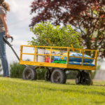 Yellow Gorilla Made utility cart with plants and gardening supplies.