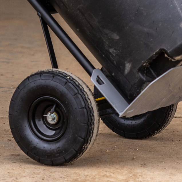 Close-up of a Gorilla Made heavy-duty cart wheel on a concrete surface.