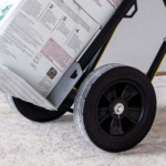 Hand truck carrying boxes with visible wheel detail. Text: "2 3 4".