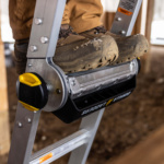 Close-up of boots on the Gorilla Made ladder with a sturdy metal build.