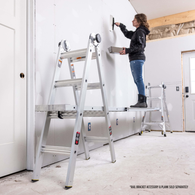 Person using a Gorilla Made ladder and plank for wall work; text: "RAIL BRACKET ACCESSORY & PLANK SOLD SEPARATELY."
