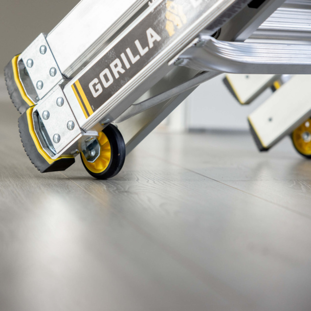Silver ladder with "GORILLA" text on side, featuring yellow and black wheels.