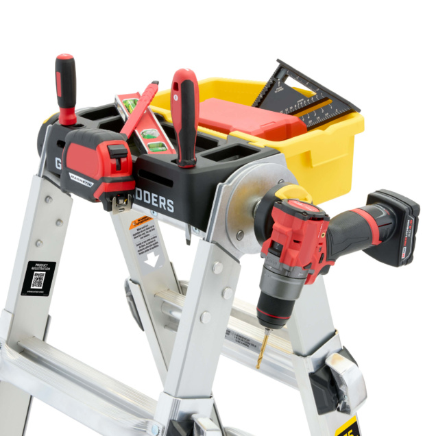 Close-up of GMPXT ladder top with tools, featuring red drill and yellow tray.