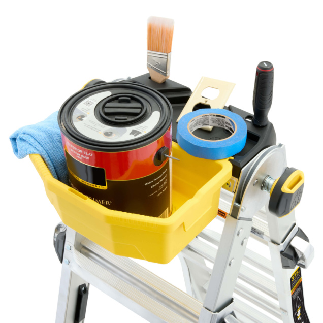 Yellow utility tray on ladder with paint can, brush, tape, and cloth.