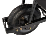 Close-up of a Gorilla Made heavy-duty wheelbarrow tire, showcasing tread and metal frame.