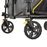 Close-up of Gorilla Made utility cart's durable black and yellow wheel assembly.