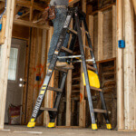 Gorilla heavy-duty ladder in use at a construction site, marked "300 LB".