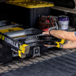Gorilla Made GF300 ladder with yellow accents being loaded into a vehicle.