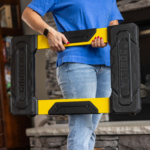 Person holding a Gorilla Made yellow and black utility item with "GORILLA" text.